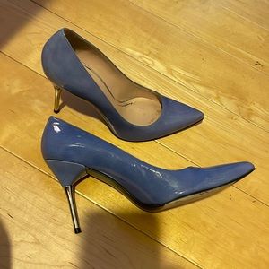 Gently used and truly loved blue patten leather stilettos with chrome heel.